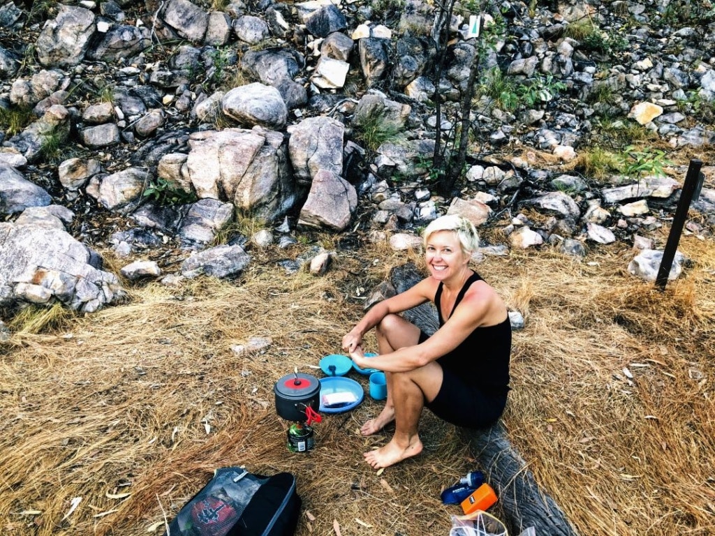Woman  cooking dinner at 17 Mile Falls cam, Jatbula Trail
