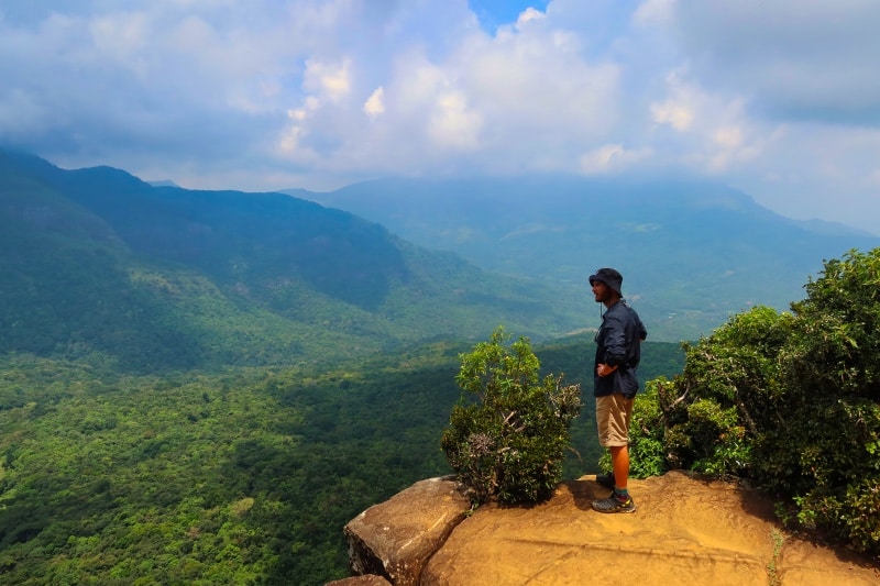 Zandy standing on the edge of Mini World's End Sri Lanka located within the Knuckles Mountain Range, Riverston.