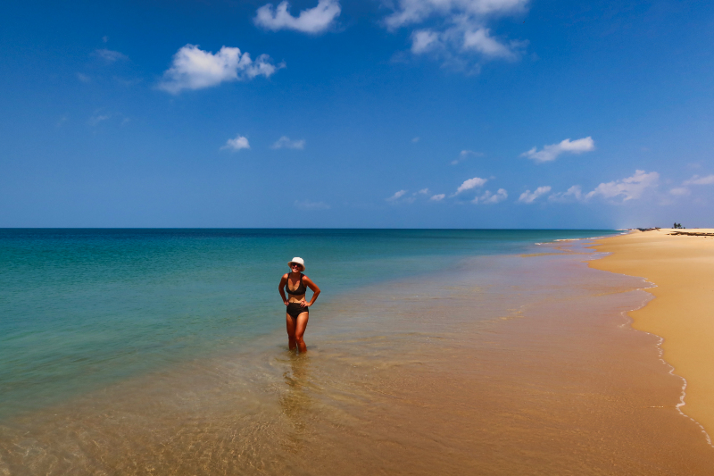 Woman standing on beach in north Sri Lanka - Fun things to do in north Sri Lanka
