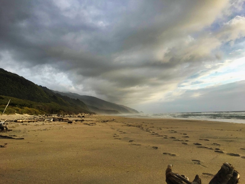 Dark clouds forming over a beach in the Heaphy Track 