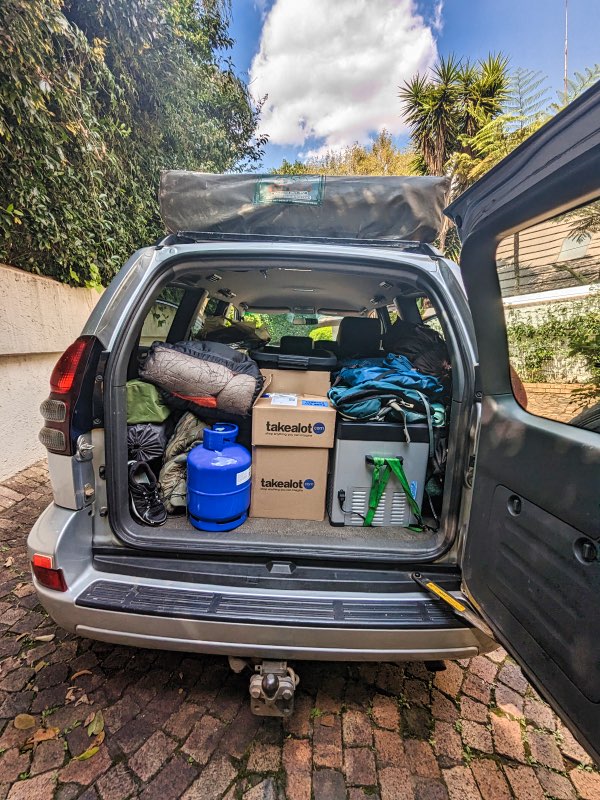 A car loaded with lots of equipment