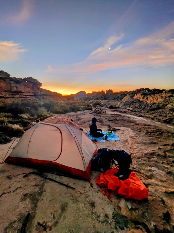 A tent over sunset at the Wolfberg Cracks 