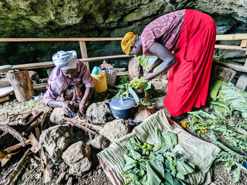 Two woman cooking in Kapchorwa 