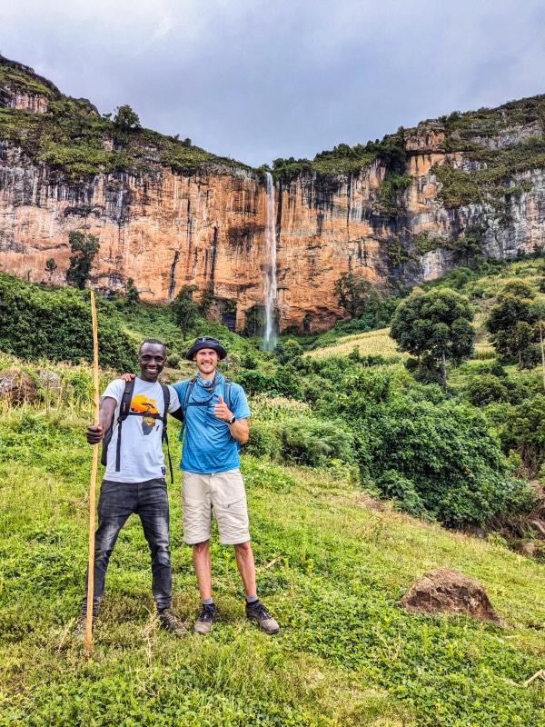 Standing in front of a waterfall in Mount Elgon