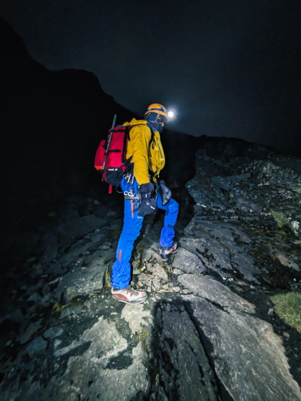 Man standing in the dark below Margherita Peak