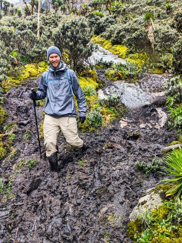 Zandy navigating the mud on the Rwenzori Mountains
